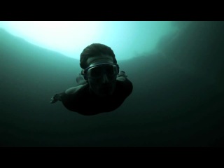 jump into the abyss, listed in the guinness book of records. world champion diver guillaume nery dives into dean's blue hole. dahab. egypt.